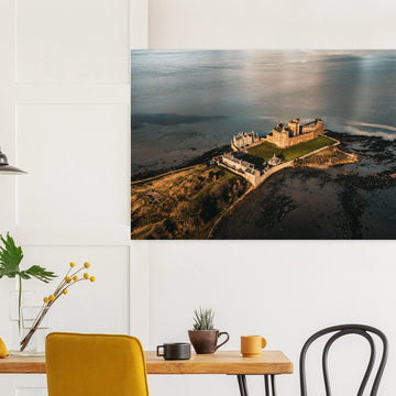 Blackness Castle aerial sunset wall art with fortress and pier glowing in golden evening light