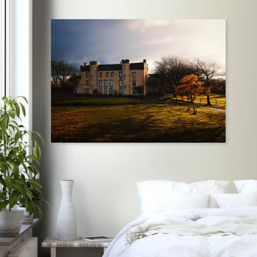 House of the Binns sunset wall art with golden sky over historic house and parkland
