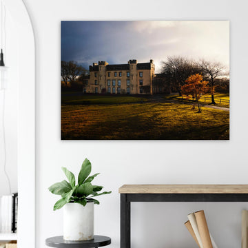 House of the Binns sunset wall art with golden sky over historic house and parkland