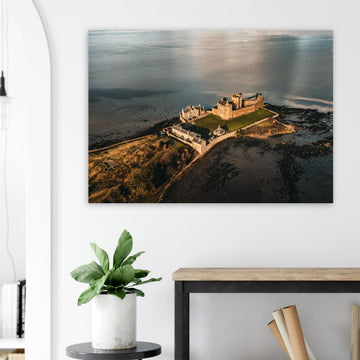 Blackness Castle aerial sunset wall art with fortress and pier glowing in golden evening light