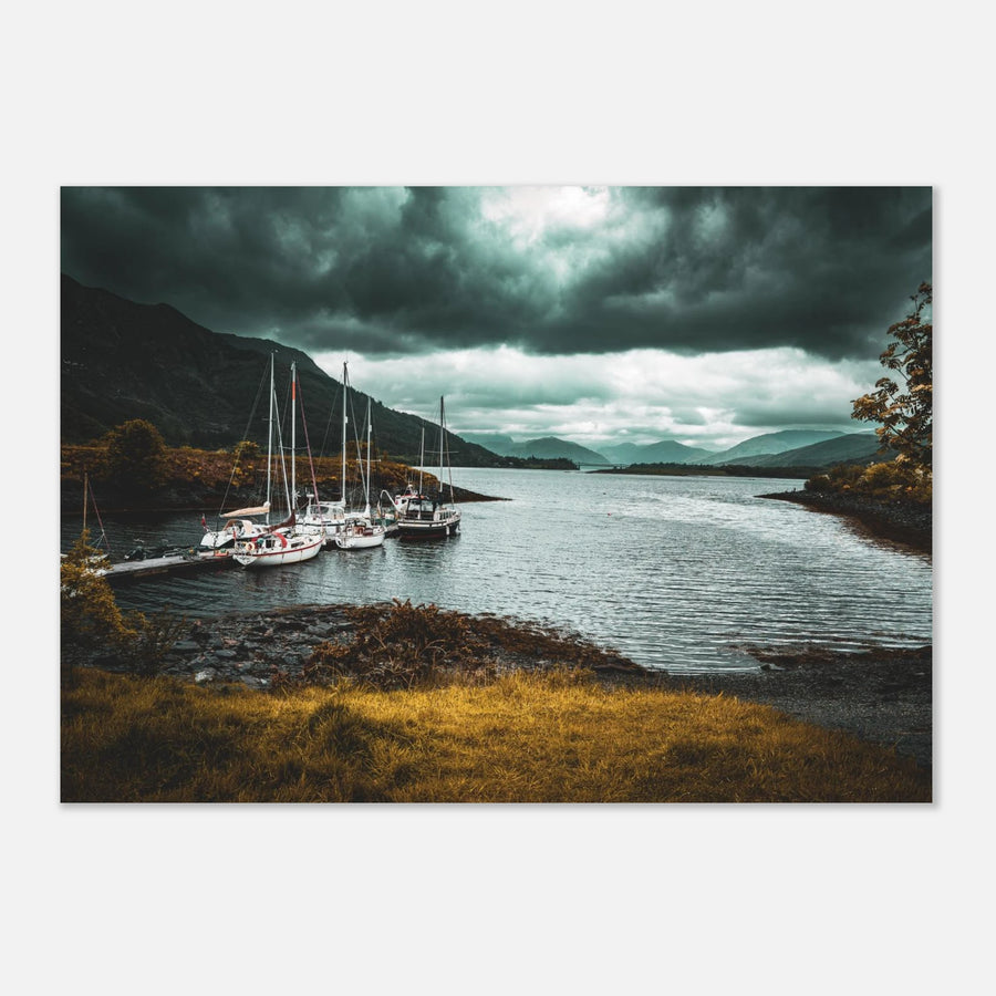 Ballachulish dockyard wall art showing yachts moored at a small dock with dark hills, teal water and heavy storm clouds on the Scottish west coast