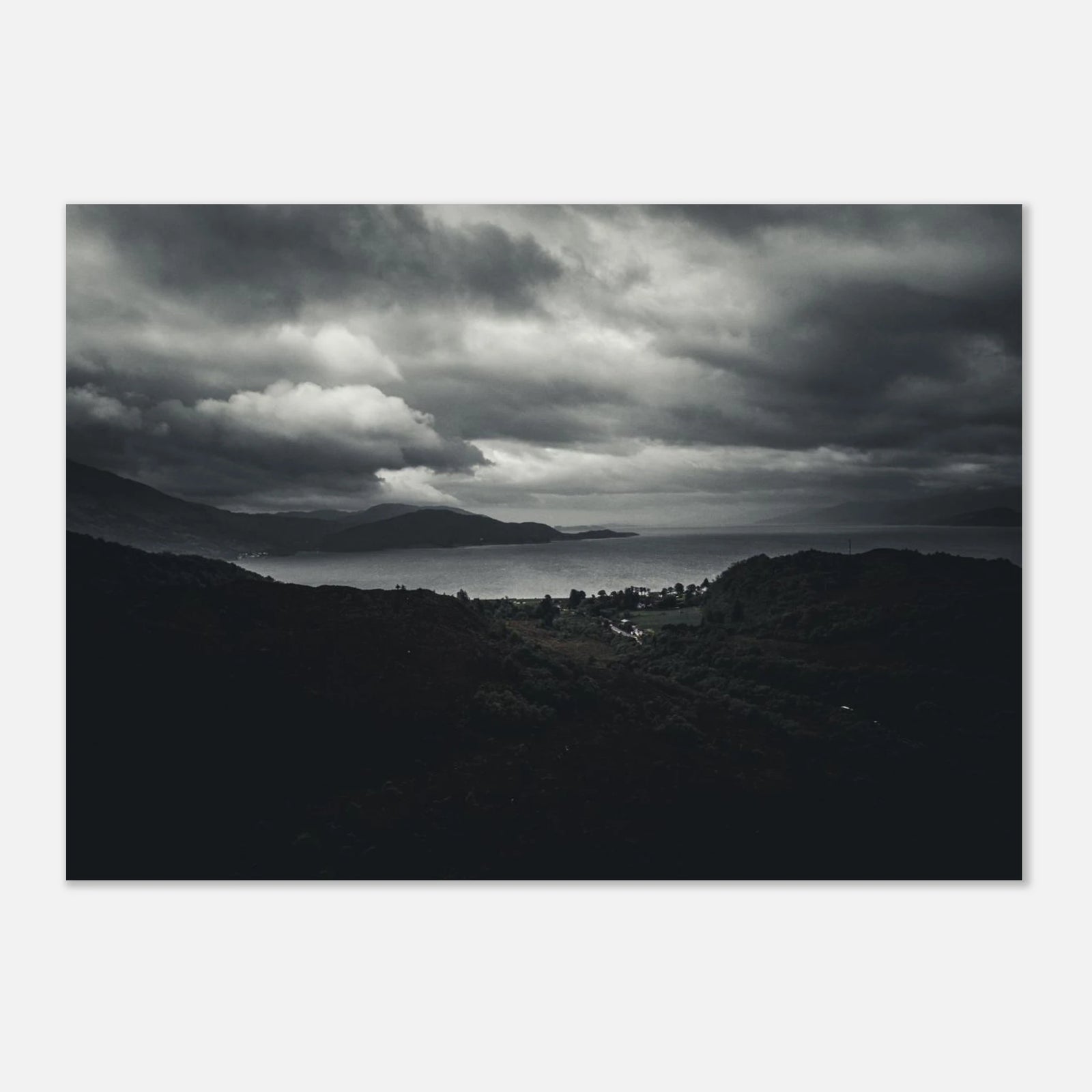 Loch Linnhe Scottish Highlands wall art showing a dark moody view over the sea loch with distant hills and heavy storm clouds above the Scottish coastline
