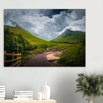 Glencoe orbital route stormy sky wall art with path leading through trees towards Pap of Glencoe under dark clouds