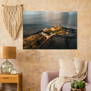 Blackness Castle aerial sunset wall art with fortress and pier glowing in golden evening light