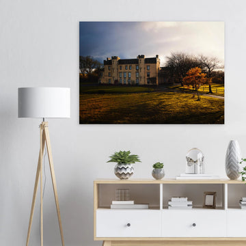 House of the Binns sunset wall art with golden sky over historic house and parkland