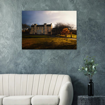 House of the Binns sunset wall art with golden sky over historic house and parkland