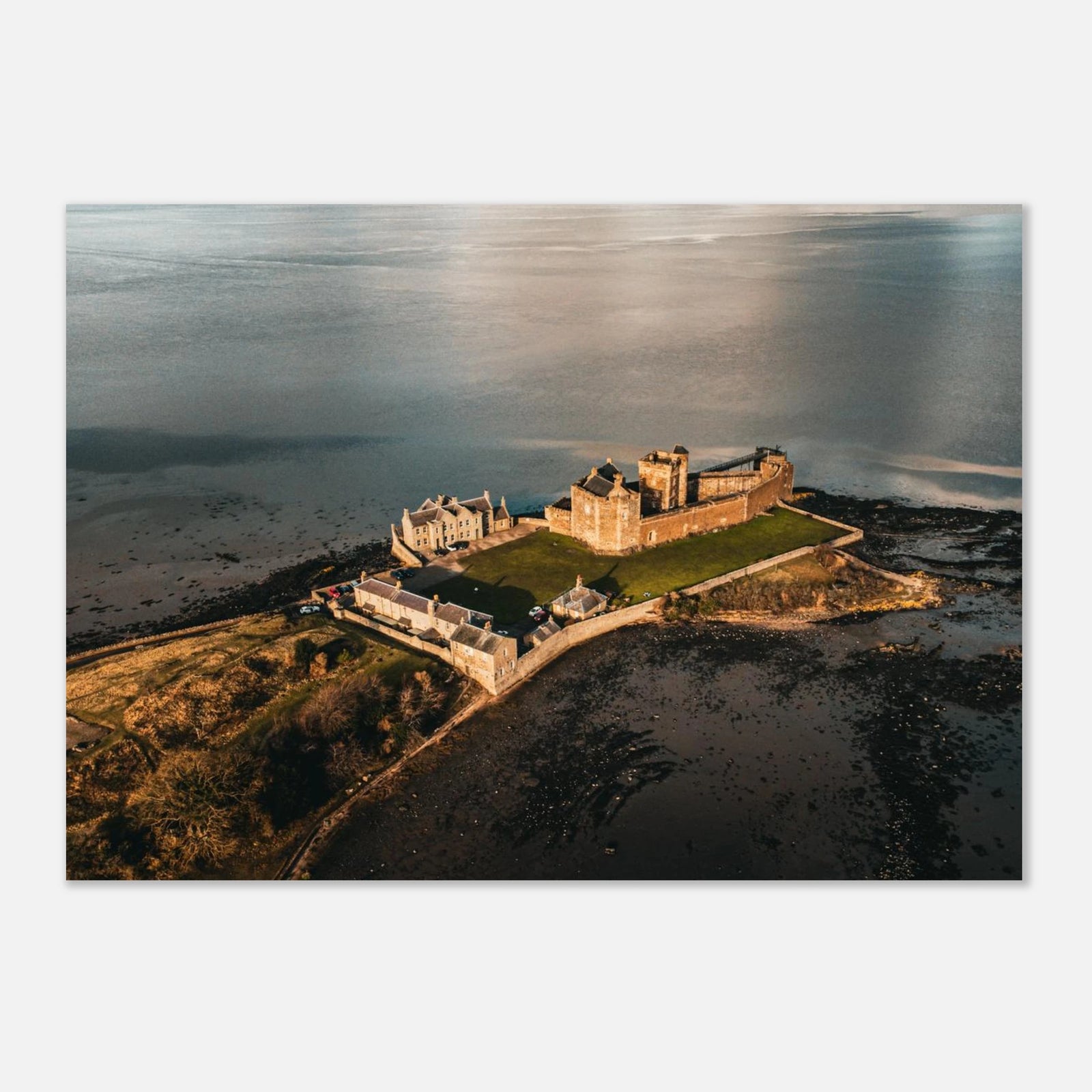 Blackness Castle aerial sunset wall art with fortress and pier glowing in golden evening light