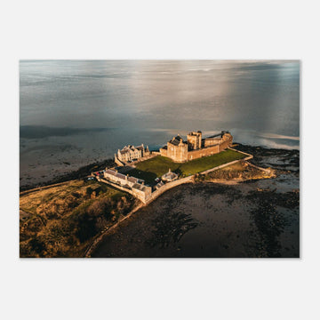 Blackness Castle aerial sunset wall art with fortress and pier glowing in golden evening light