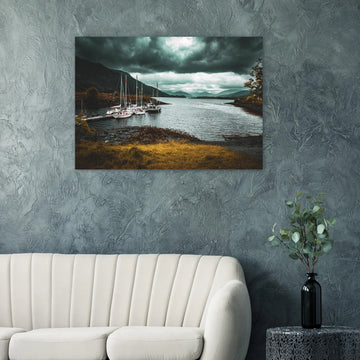 Ballachulish dockyard wall art showing yachts moored at a small dock with dark hills, teal water and heavy storm clouds on the Scottish west coast