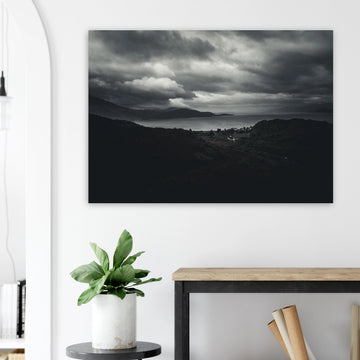 Loch Linnhe Scottish Highlands wall art showing a dark moody view over the sea loch with distant hills and heavy storm clouds above the Scottish coastline