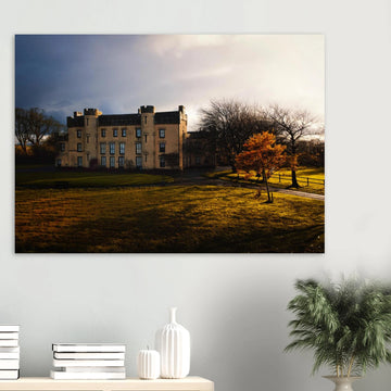 House of the Binns sunset wall art with golden sky over historic house and parkland
