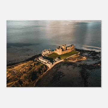 Blackness Castle aerial sunset wall art with fortress and pier glowing in golden evening light