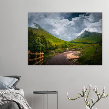 Glencoe orbital route stormy sky wall art with path leading through trees towards Pap of Glencoe under dark clouds