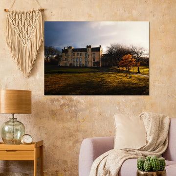 House of the Binns sunset wall art with golden sky over historic house and parkland