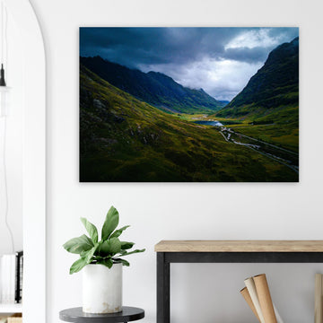 Glencoe valley wall art with moody clouds over steep Highland mountains and glen road