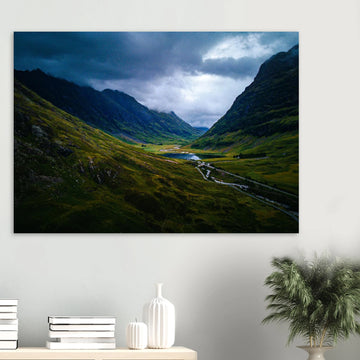 Glencoe valley wall art with moody clouds over steep Highland mountains and glen road