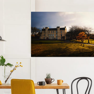 House of the Binns sunset wall art with golden sky over historic house and parkland