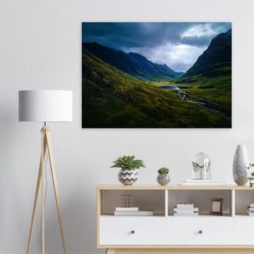 Glencoe valley wall art with moody clouds over steep Highland mountains and glen road