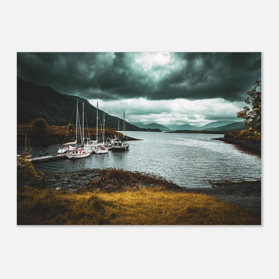 Ballachulish dockyard wall art showing yachts moored at a small dock with dark hills, teal water and heavy storm clouds on the Scottish west coast