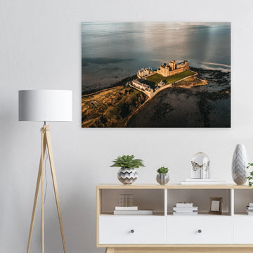Blackness Castle aerial sunset wall art with fortress and pier glowing in golden evening light