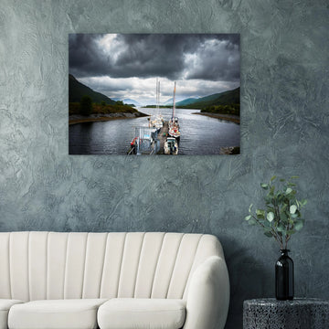 Ballachulish Harbour wall art showing yachts lined up along a narrow pier between green hills with dark storm clouds over the Scottish waterway
