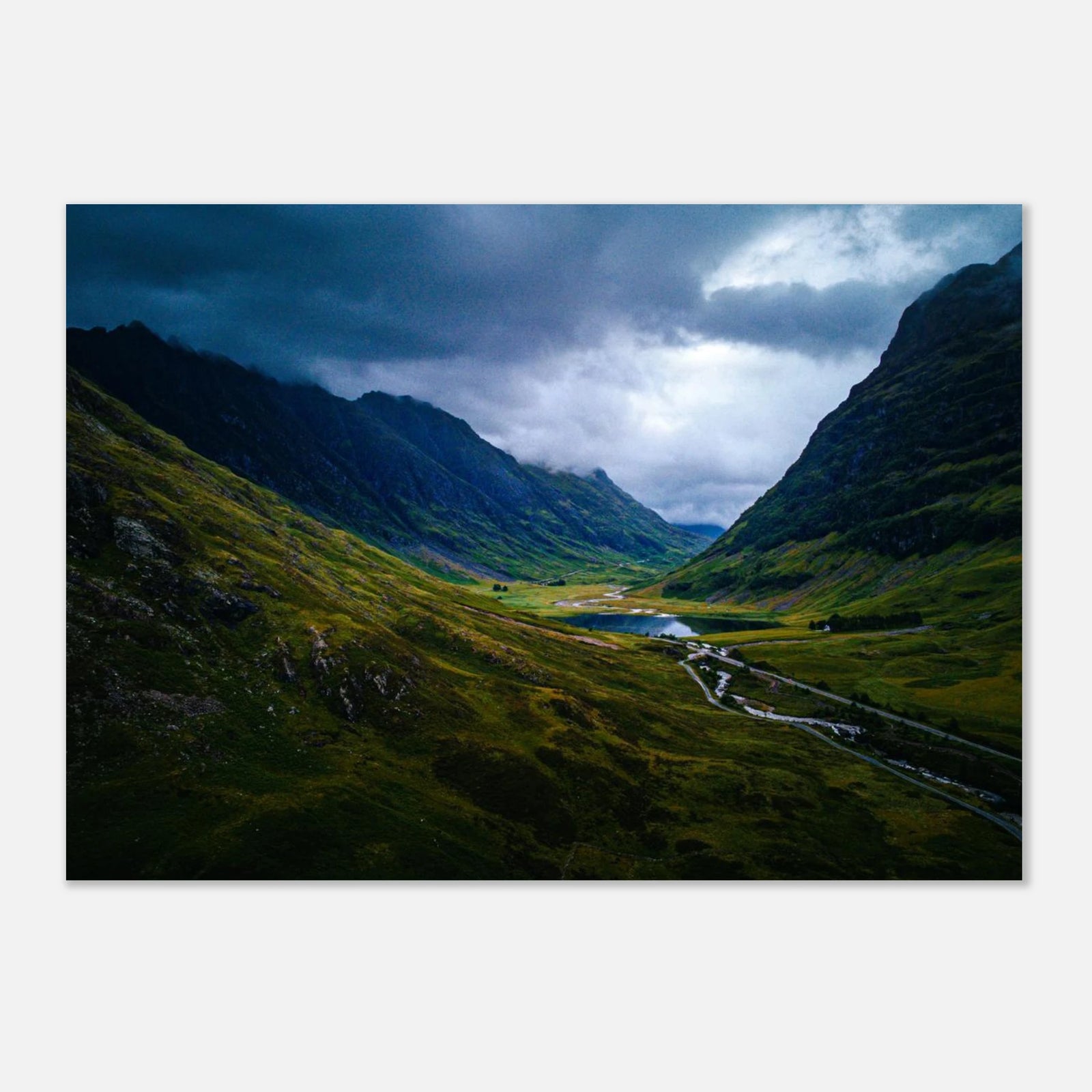 Glencoe valley wall art with moody clouds over steep Highland mountains and glen road