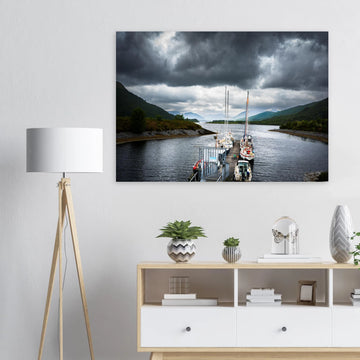 Ballachulish Harbour wall art showing yachts lined up along a narrow pier between green hills with dark storm clouds over the Scottish waterway